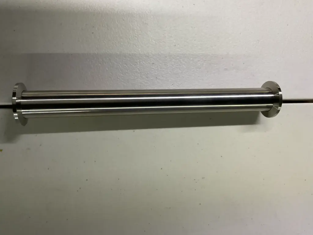 Straight stainless steel vacuum tube with KF25 (NW) flange connections and a 10-inch length for vacuum system assembly.